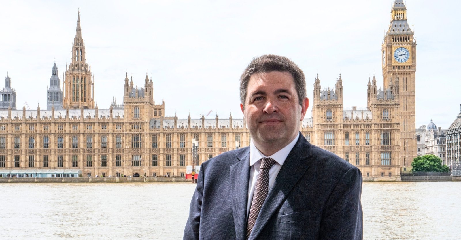 Shaun Davies MP, standing outside The Palace of Westminster