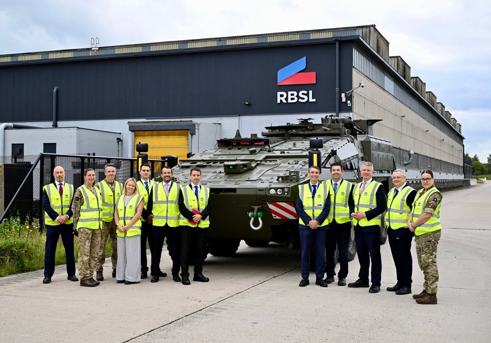 Minister Luke Pollard MP, with Shaun Davies MP, along with MOD team outside the RBSL manufacturing facility.