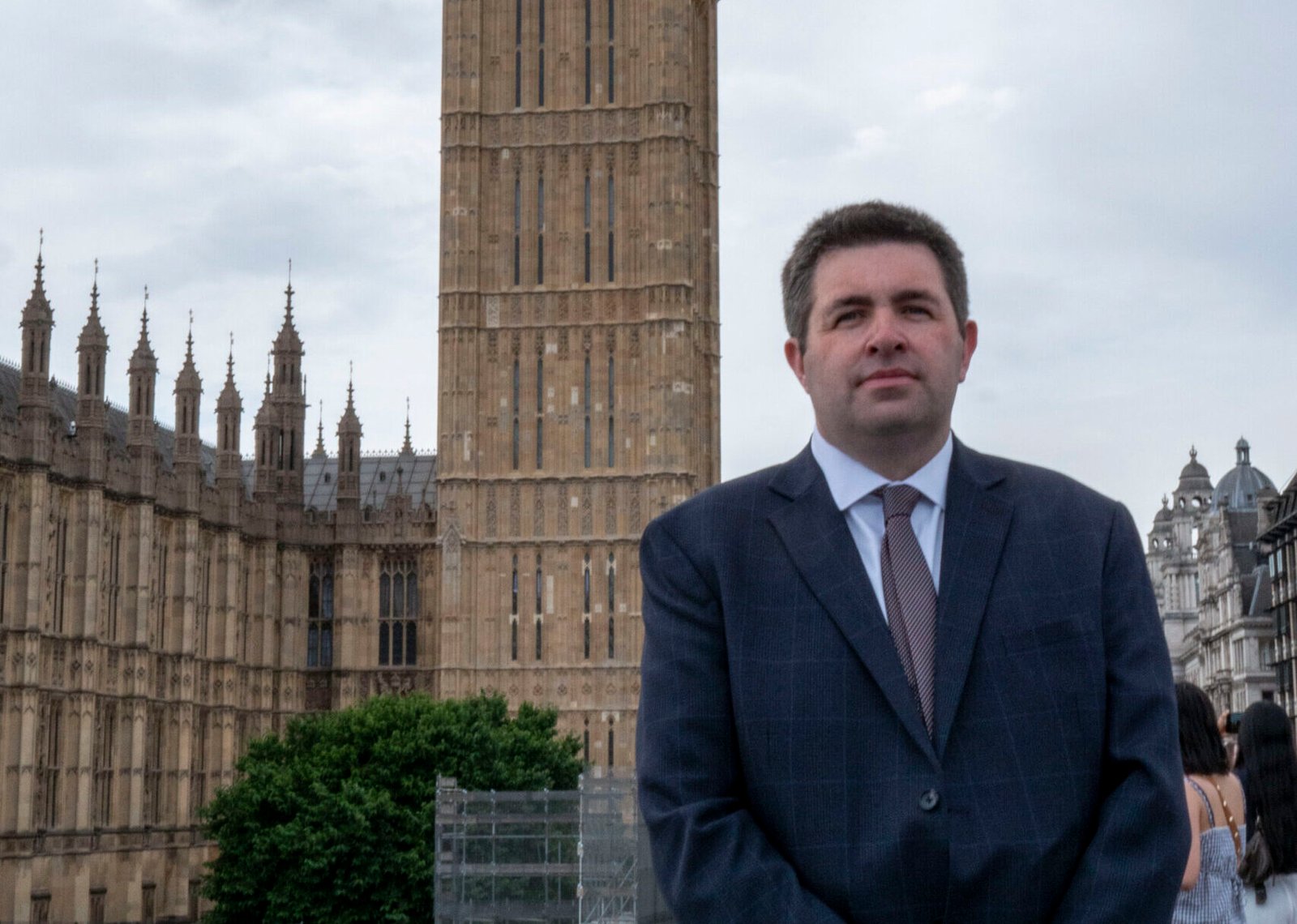 Shaun Davies - MP for Telford, standing outside Houses of Parliament.