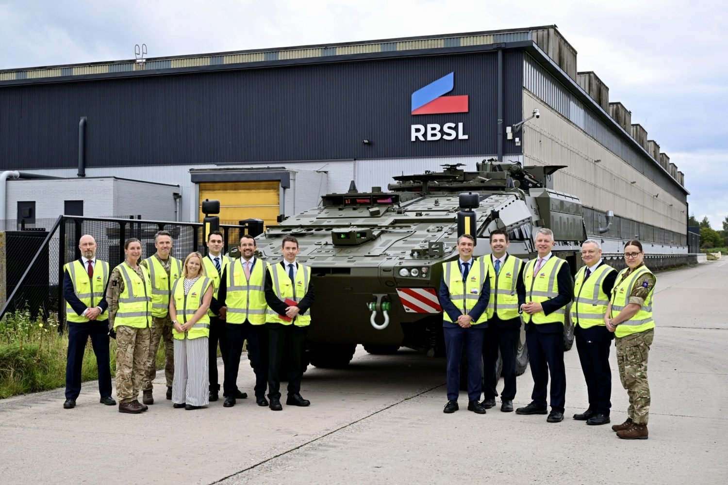EB2_2041 Minister Luke Pollard MP, with Shaun Davies MP, along with MOD team outside the RBSL manufacturing facility.