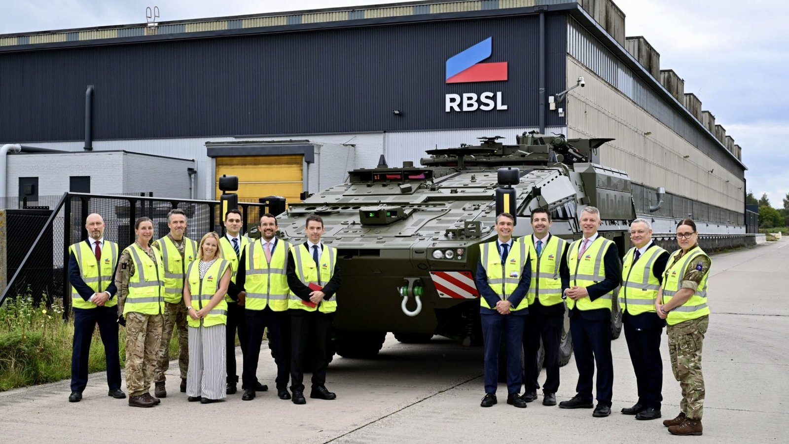 Minister Luke Pollard MP, with Shaun Davies MP, along with MOD team outside the RBSL manufacturing facility.