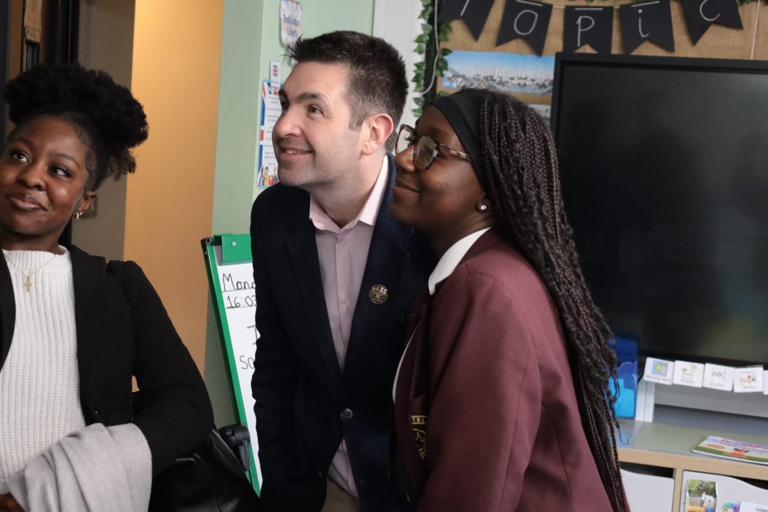 Shaun taking a selfie with students