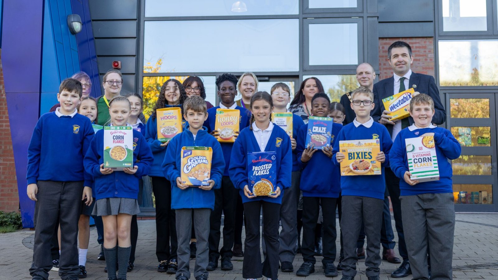 Telford's MP, Shaun Davies, outside Ladygrove Primary School, along with Borough Councillors Ben Carter & Corrine Chikandamina, school staff and students
