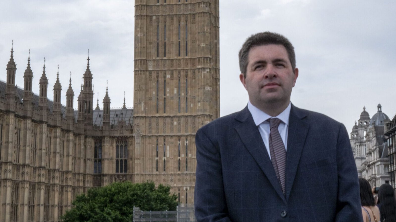 Shaun Davies - MP for Telford, standing outside Houses of Parliament.