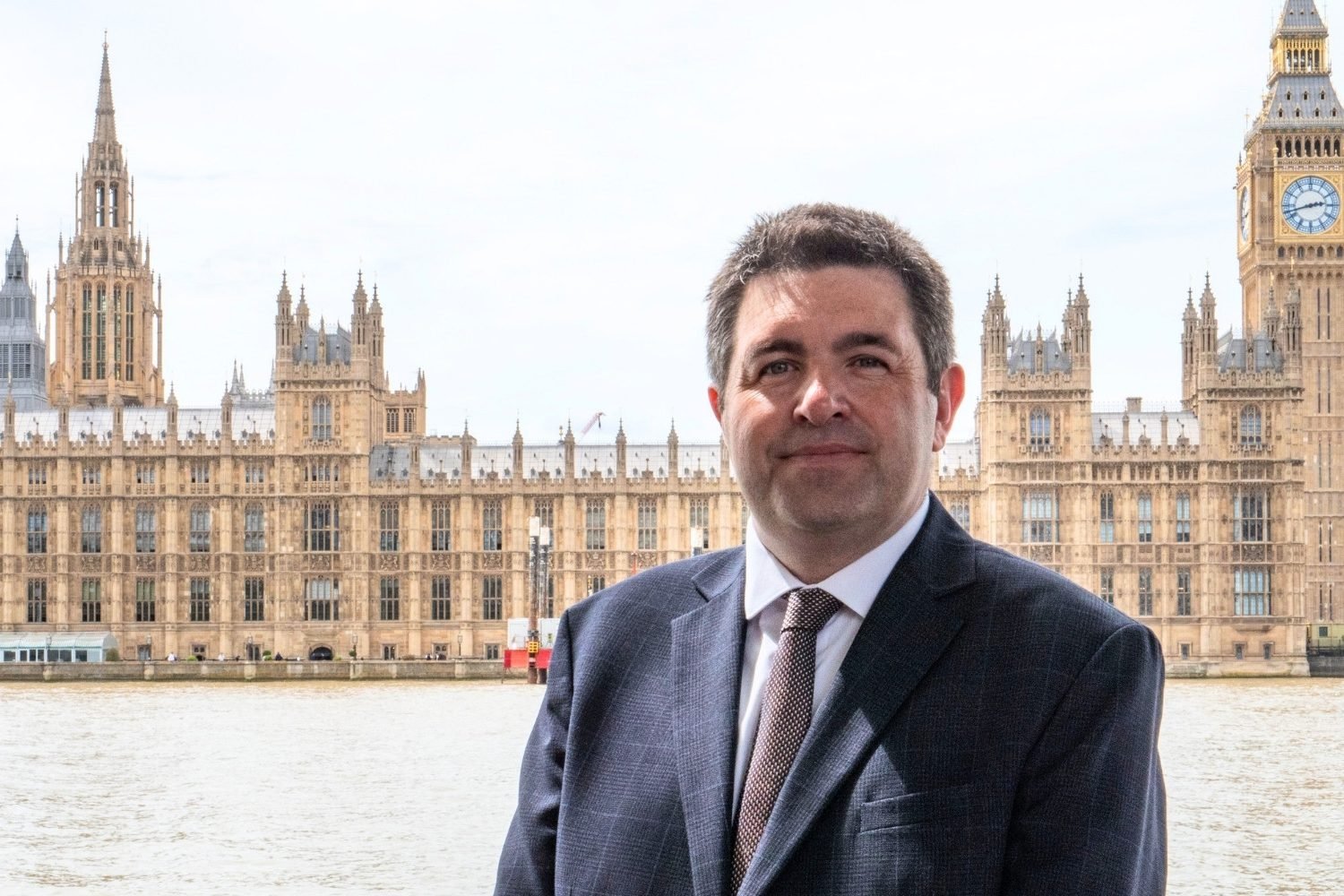 Shaun Davies MP, standing outside The Palace of Westminster