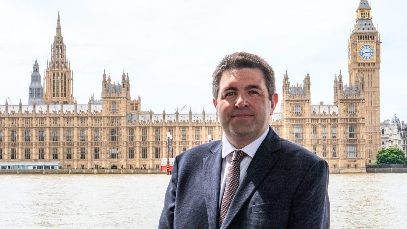 Shaun Davies MP, standing outside The Palace of Westminster